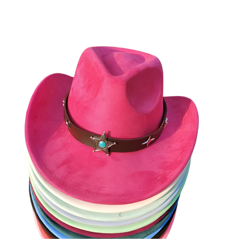 Stack of colorful cowboy hats with a pink top on grass