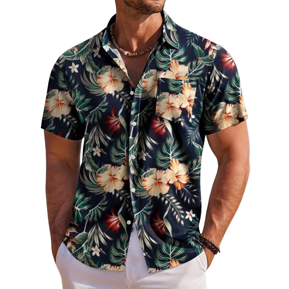 Man wearing a tropical floral patterned shirt on a white background