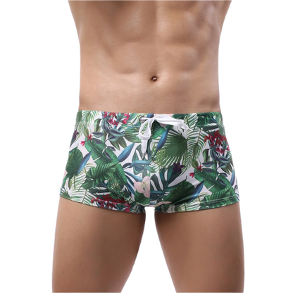 Floral-patterned boxer briefs with tropical leaf and flower design.