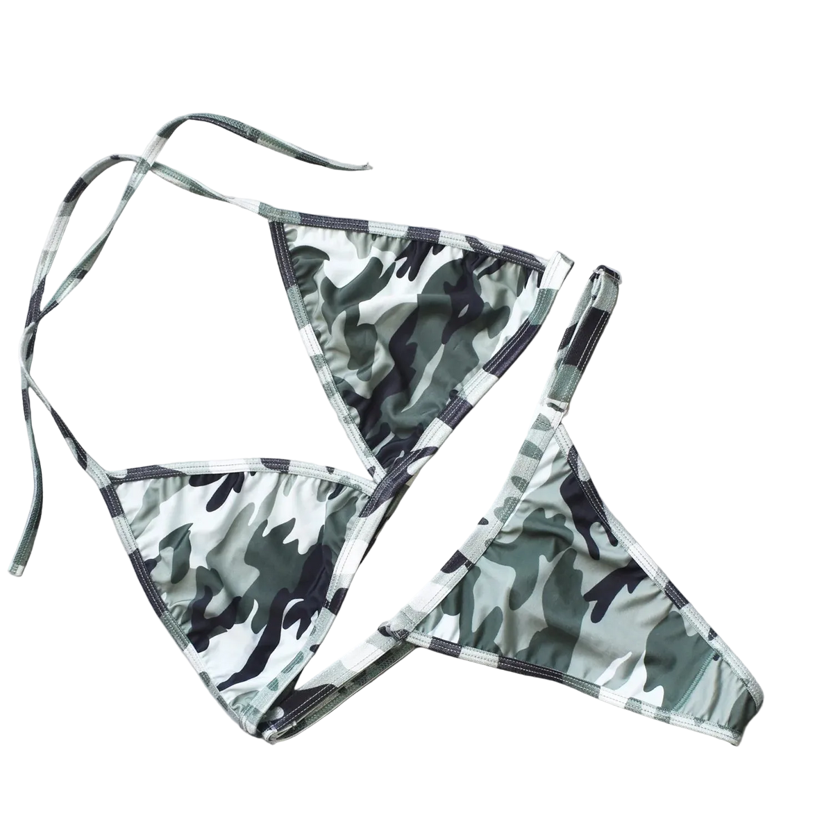 Camouflage bikini set on a light gray surface with decorative elements.