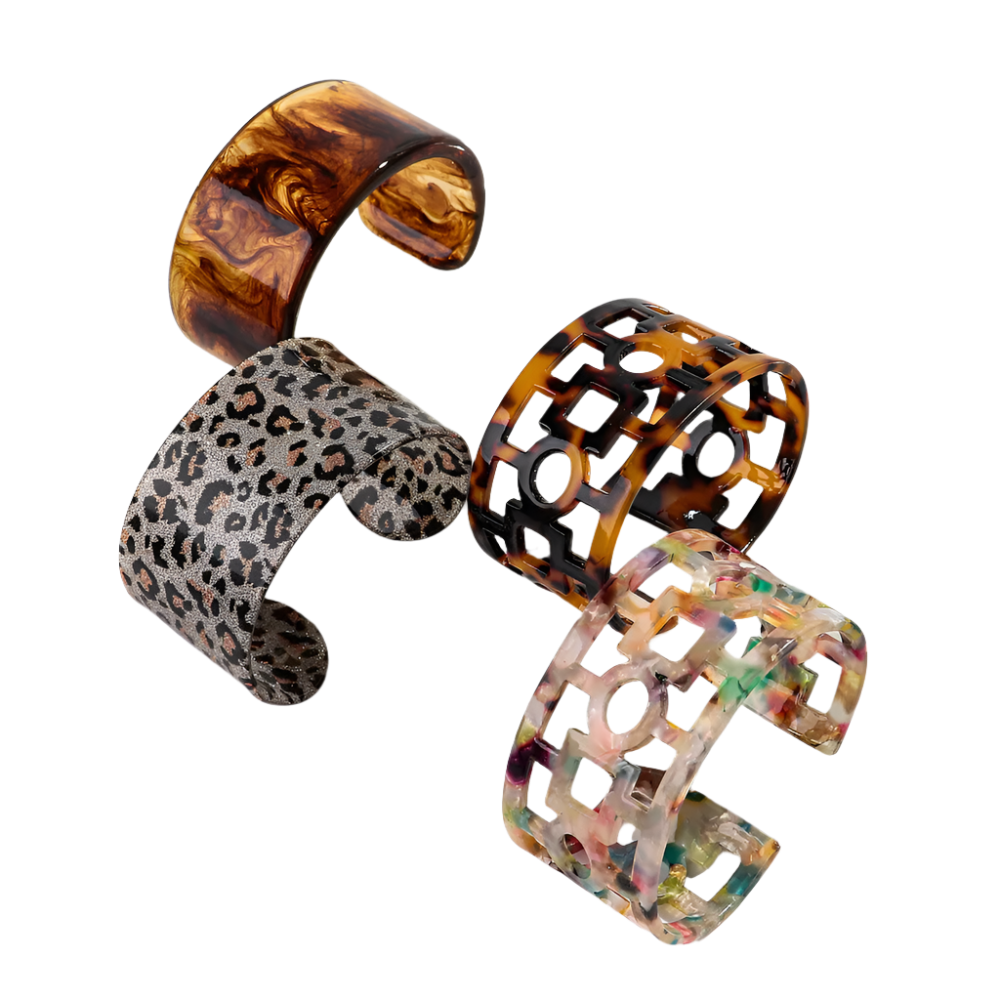 Bold leopard print wide cuff bangle featuring hollow geometric patterns and premium resin design for resort wear and theme nights

