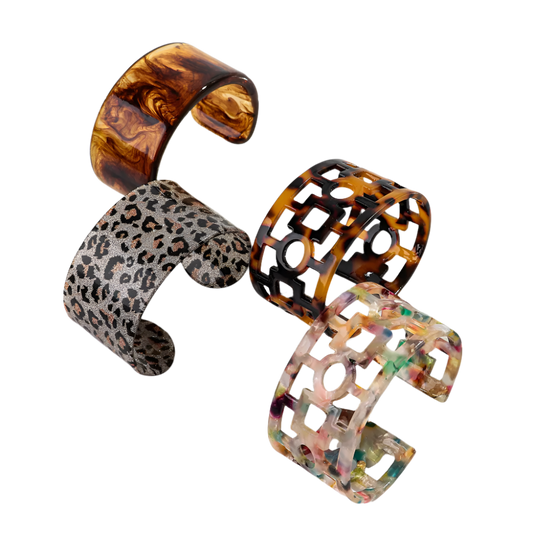 Bold leopard print wide cuff bangle featuring hollow geometric patterns and premium resin design for resort wear and theme nights

