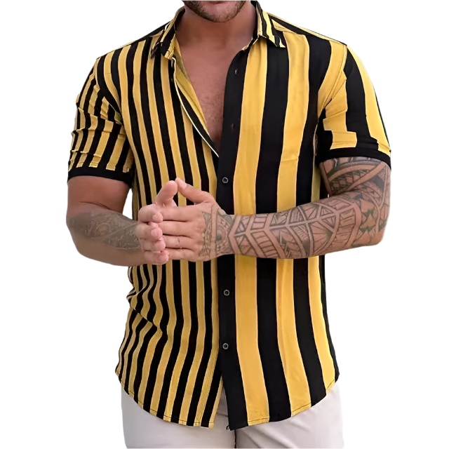 Man wearing a black and yellow striped shirt with tattoos on arms.