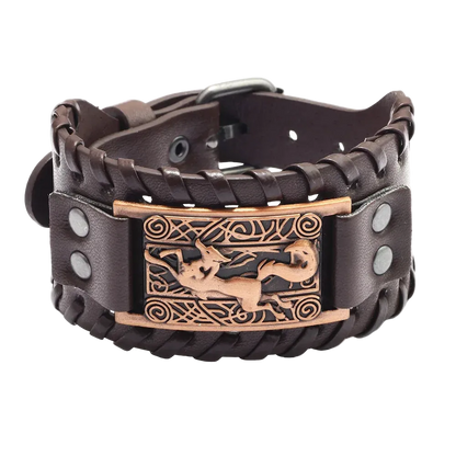 Brown leather bracelet with bronze decorative clasp on a white background