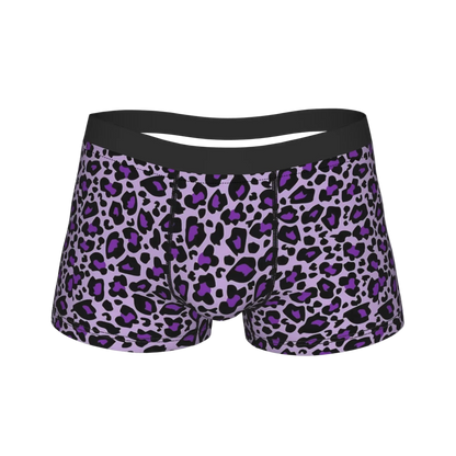 A pair of men's boxer briefs featuring a purple and black leopard print pattern with a solid black waistband, shown against a plain white background.