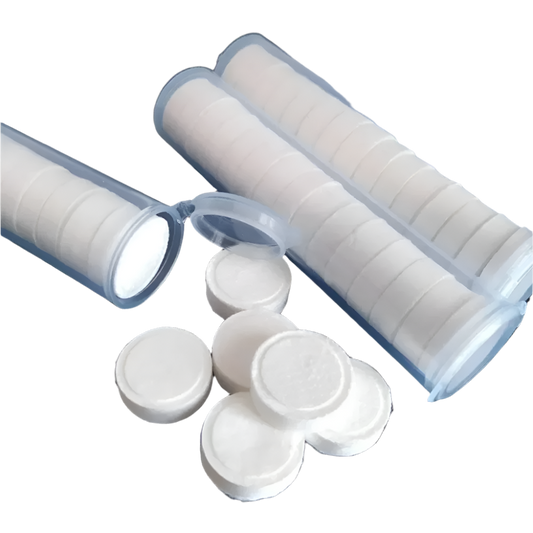 Compressed Towels: A collection of white compressed towels packaged in transparent tubes, ready for use when expanded with water