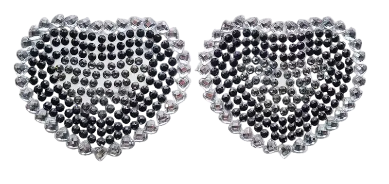 Heart-shaped rhinestone stickers on a white card with a dark background