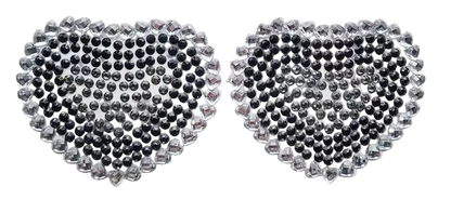 Heart-shaped rhinestone stickers on a white card with a dark background