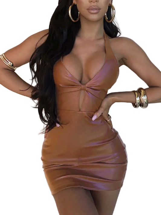 Woman wearing a brown leather dress with gold accessories on a white background