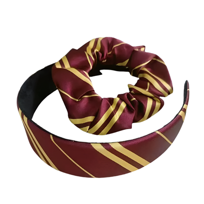 Maroon and gold striped headband on a white background