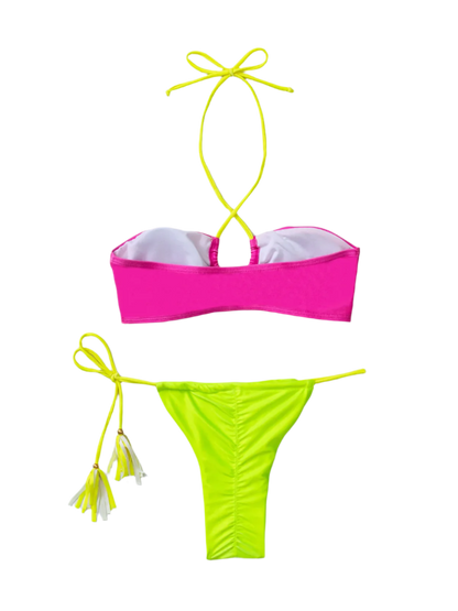 A vibrant bikini with a hot pink top and neon green bottoms. It features a minimal design with string ties, creating a bold and colorful look.