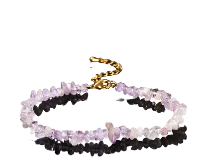 Natural Violet Amethyst bracelet with gold clasp on a black background
