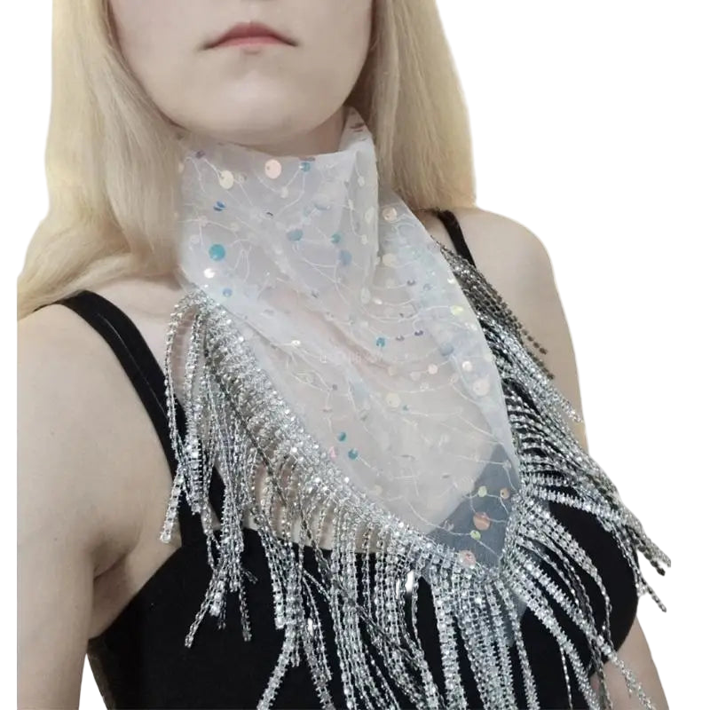 Person wearing a sparkling scarf with fringe on a white background