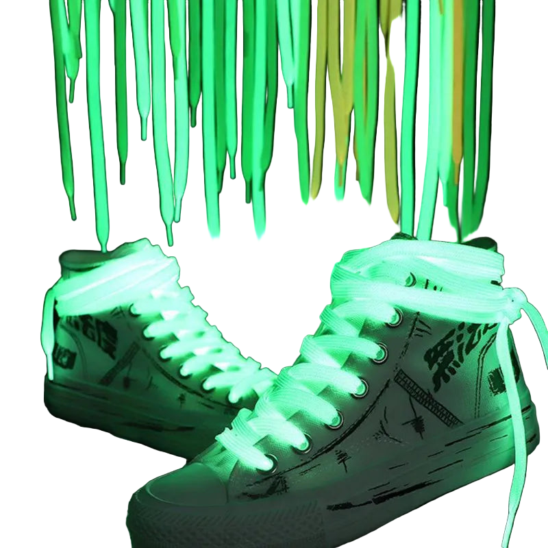 White sneakers with green glowing shoelaces against a dark background