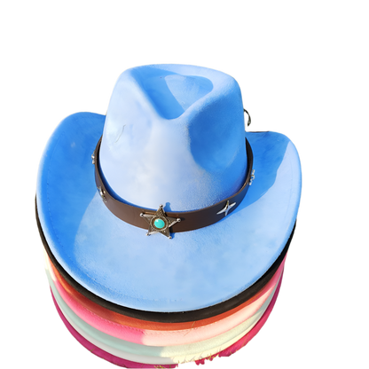 Stack of colorful cowboy hats with a star emblem on a grassy background