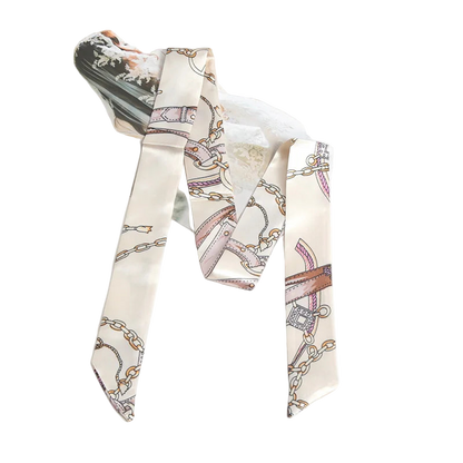 Decorative scarf with chain pattern on a white surface