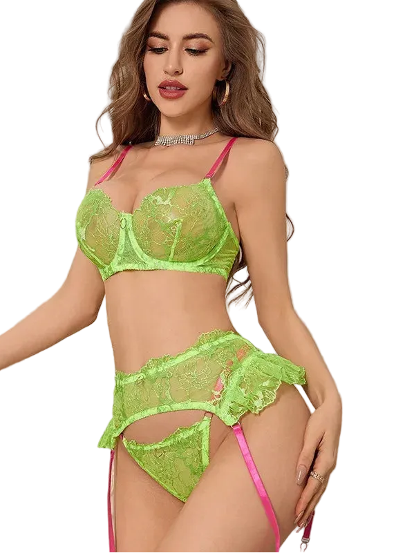 A woman models a bright neon green lace lingerie set with pink straps in an elegant bathroom setting with a white marble vanity and mirror.
