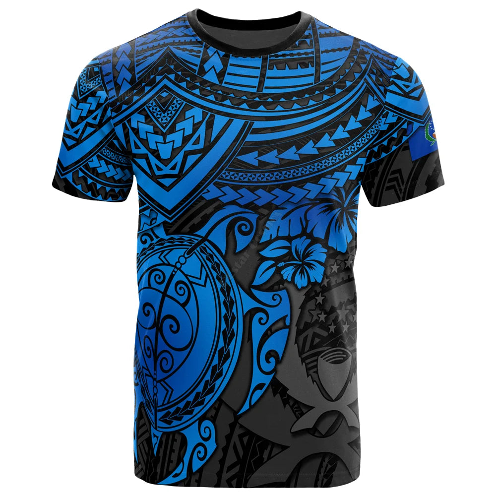 blue and black tribal-patterned t-shirt with turtle and floral designs.