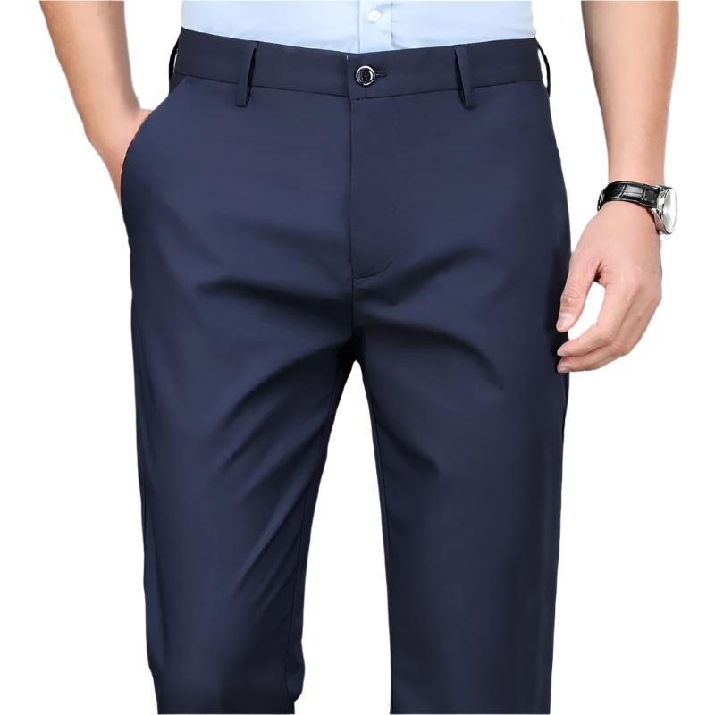 Navy blue dress pants worn by a person on a gray background