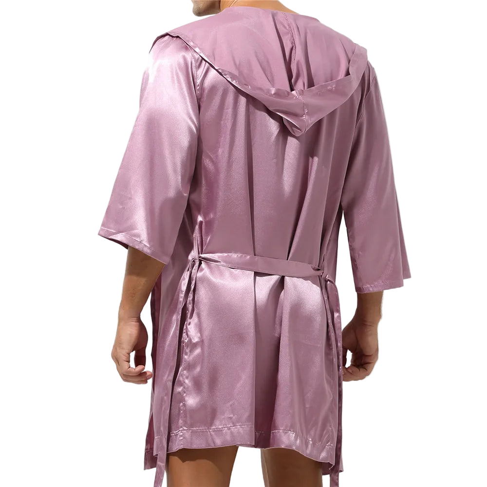 Pink satin robe worn by a person on a white background