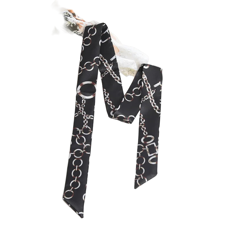 Black scarf with chain pattern on a marble surface