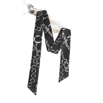 Black scarf with chain pattern on a marble surface