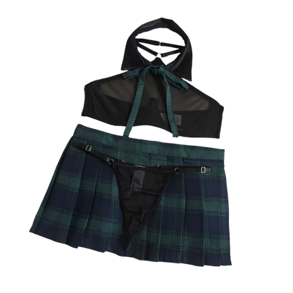 Black sheer top and plaid skirt on a beige background with flowers.