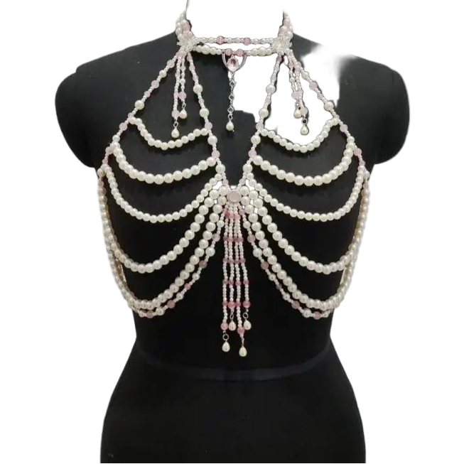 Pearl and crystal body chain on a mannequin against a white background