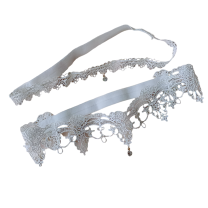 Crystal pendant lace garters with decorative thigh bands in white and black for resort evenings

