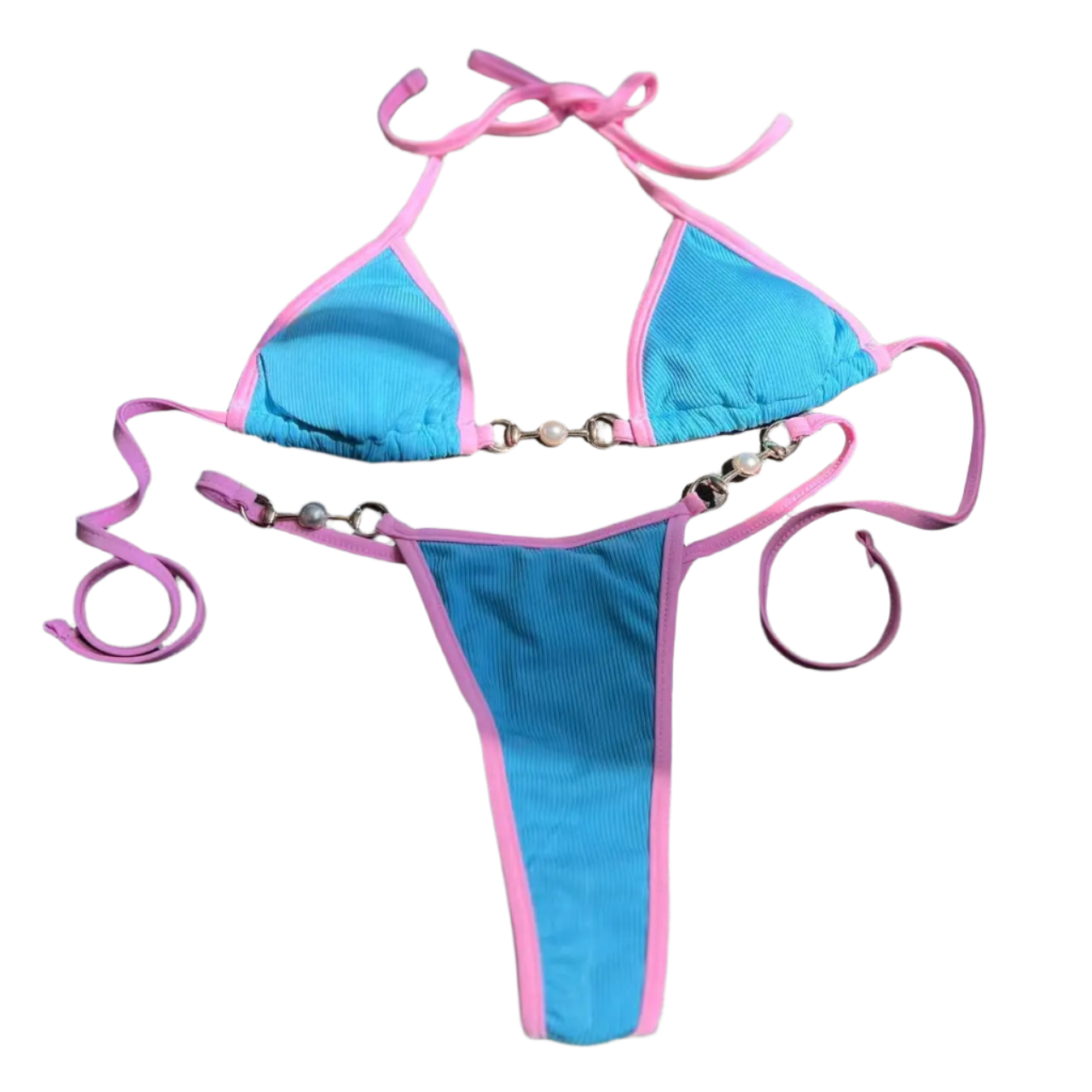 A two tone bikini with chain details. The design is sleek and modern, with a touch of edginess from the metallic accents.
