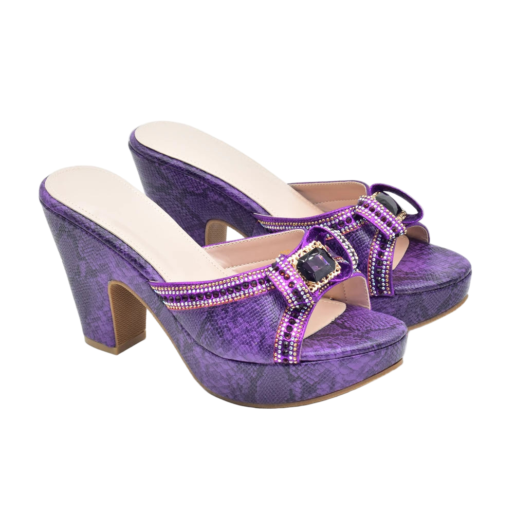 Purple high-heeled shoes with embellishments on a white background