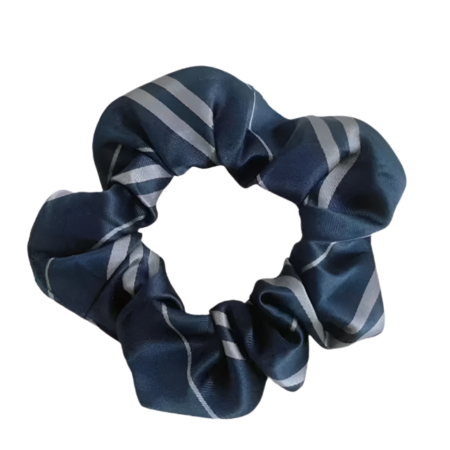 Navy blue scrunchie with gray stripes on a white background