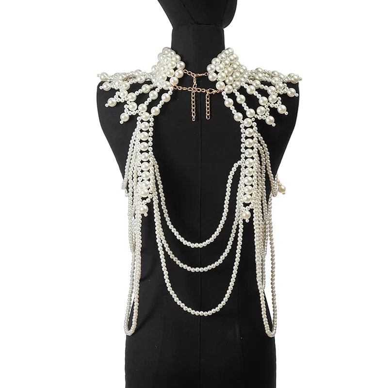 Pearl necklace and shoulder piece on a black mannequin against a white background