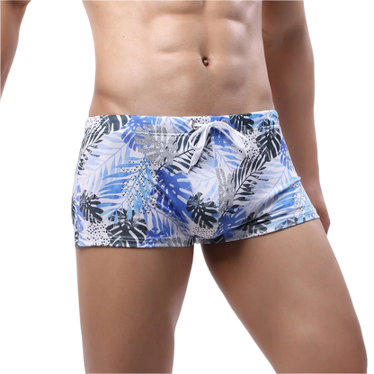 Floral-patterned boxer briefs with tropical leaf and flower design.