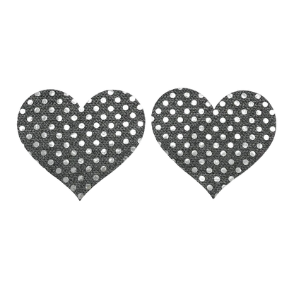 Heart-shaped black pasties with white polka dots on a white background